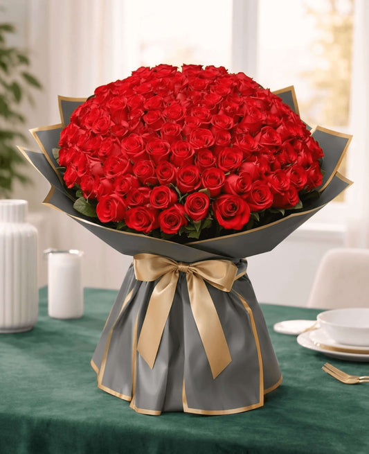 Luxury bouquet of 75 premium fresh red roses with elegant black and gold wrapping by CPlants Dubai UAE.